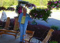 Hanging baskets and rocking chairs on our porch